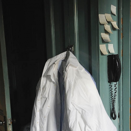 Dr. Dixon is known for wearing a white button shirt, black tie, gray suit coat and hush puppies. Occasionally he will wear a blue or yellow shirt.